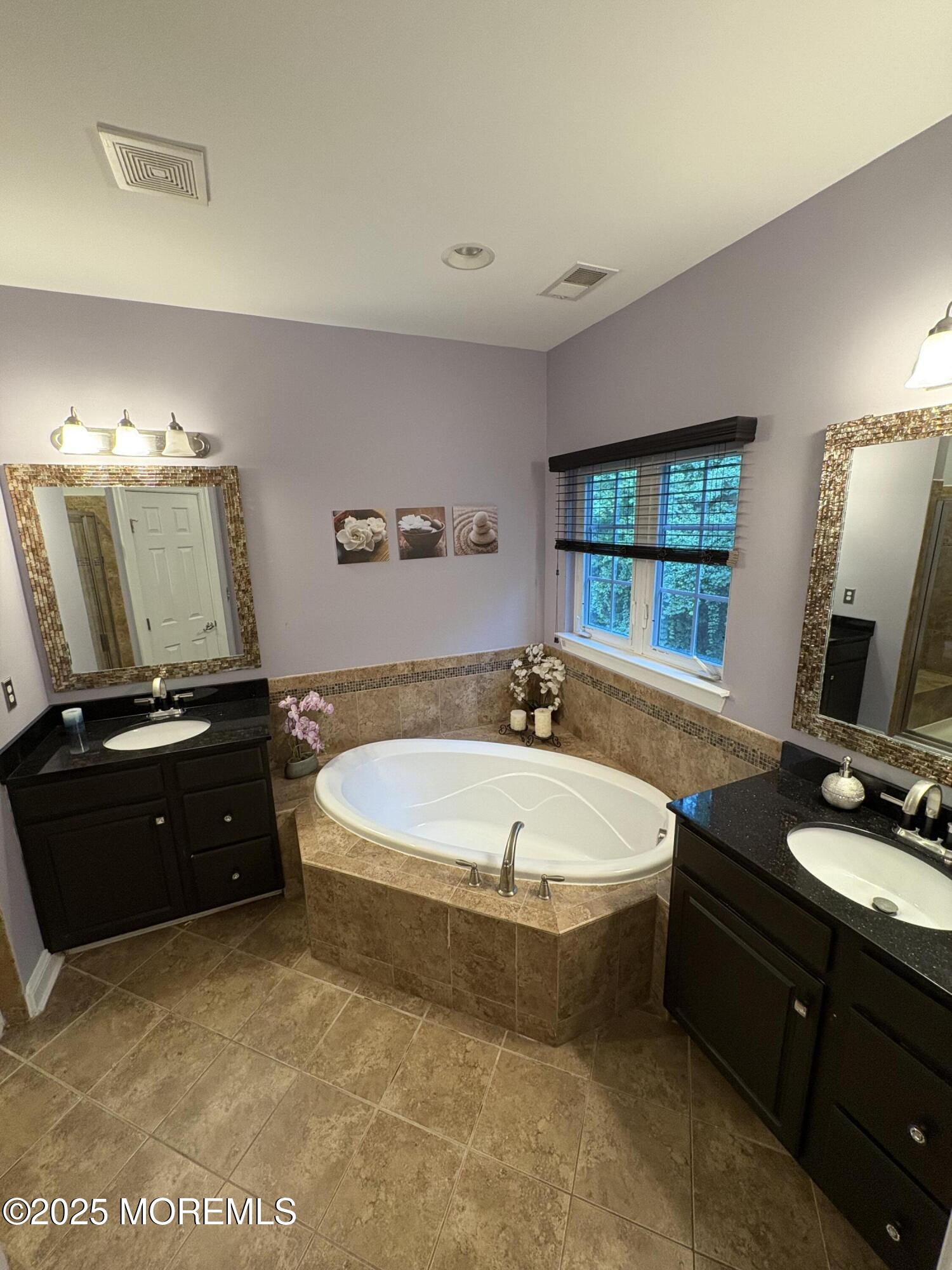 63 Pate Drive Middletown, NJ 07748 - Photo 21 of 50 a spacious bathroom with a bathtub and a sink