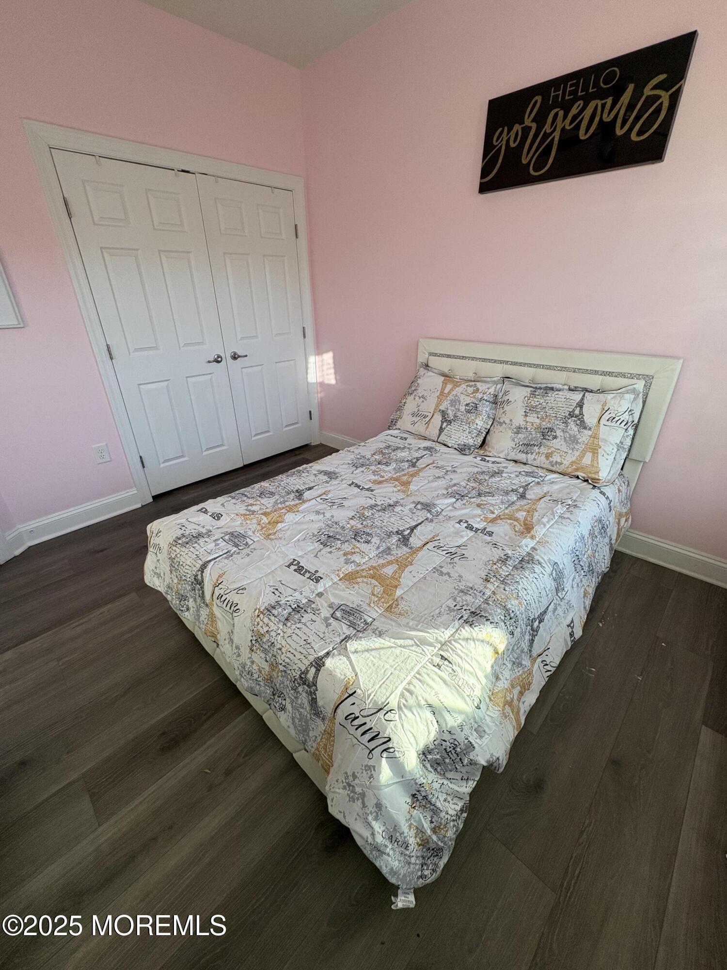 63 Pate Drive Middletown, NJ 07748 - Photo 30 of 50 a bed sitting in a bedroom next to a cabinet