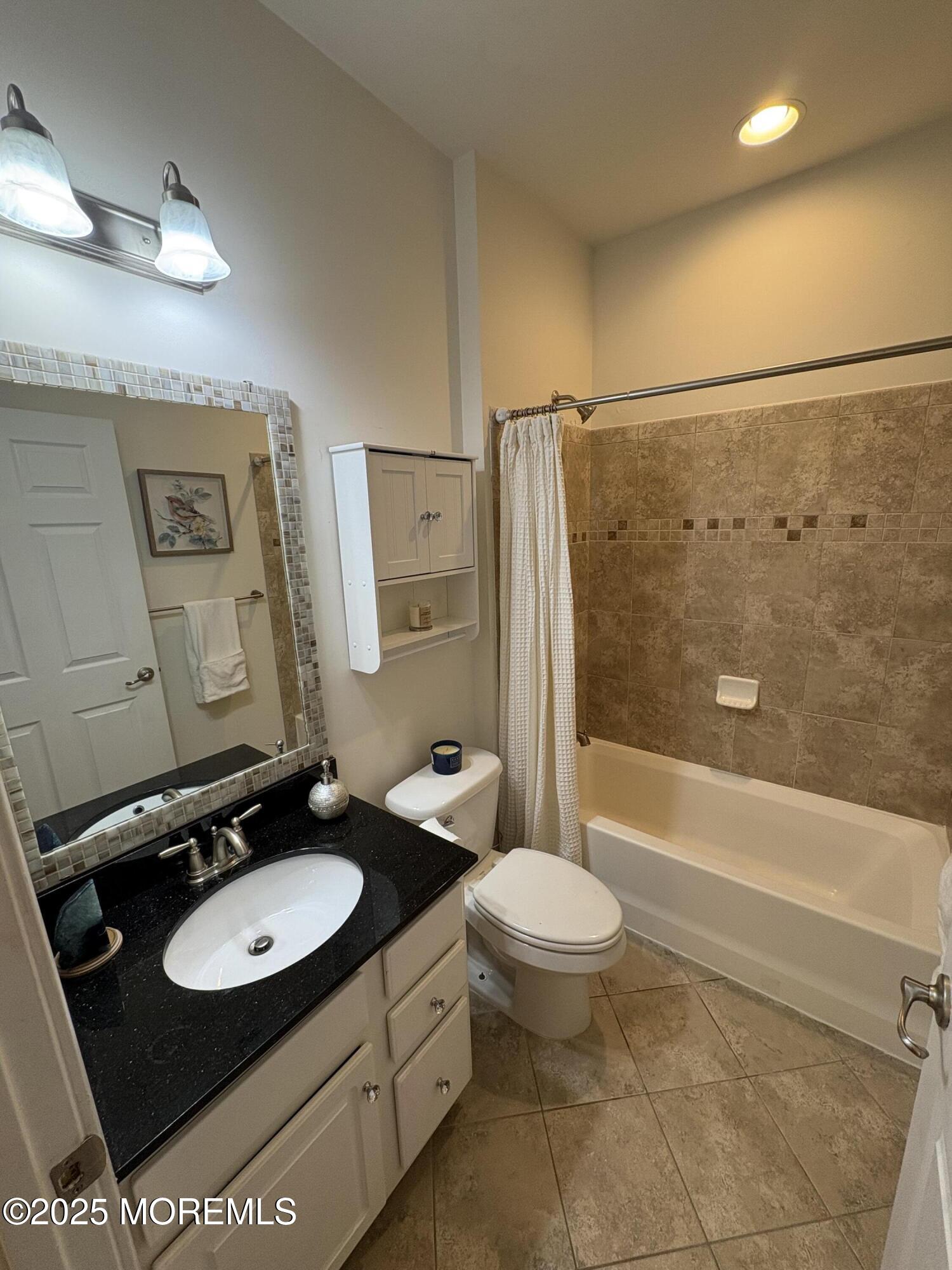 63 Pate Drive Middletown, NJ 07748 - Photo 32 of 50 a bathroom with a sink toilet and shower