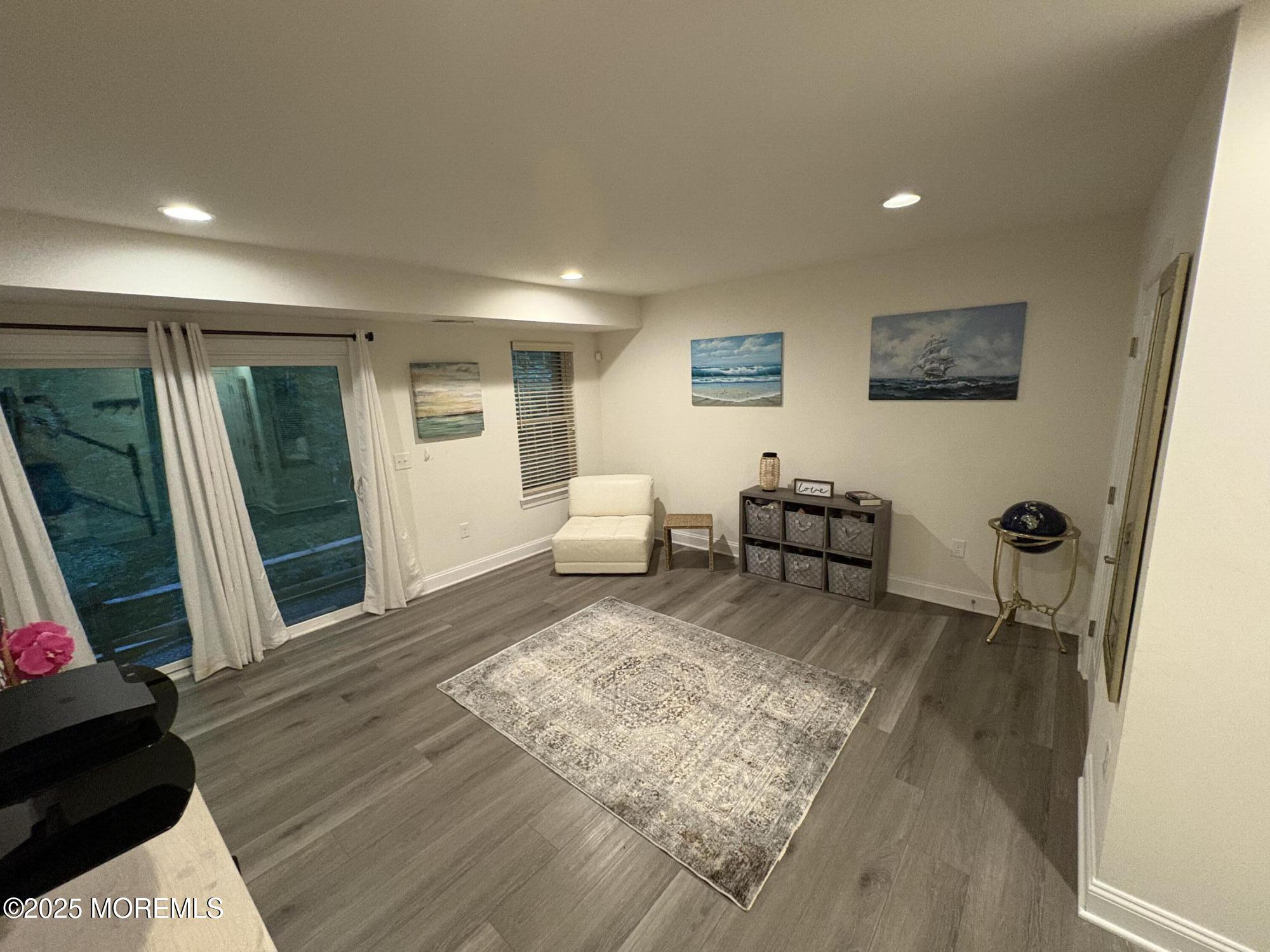 63 Pate Drive Middletown, NJ 07748 - Photo 37 of 50 a living room with furniture and a flat screen tv