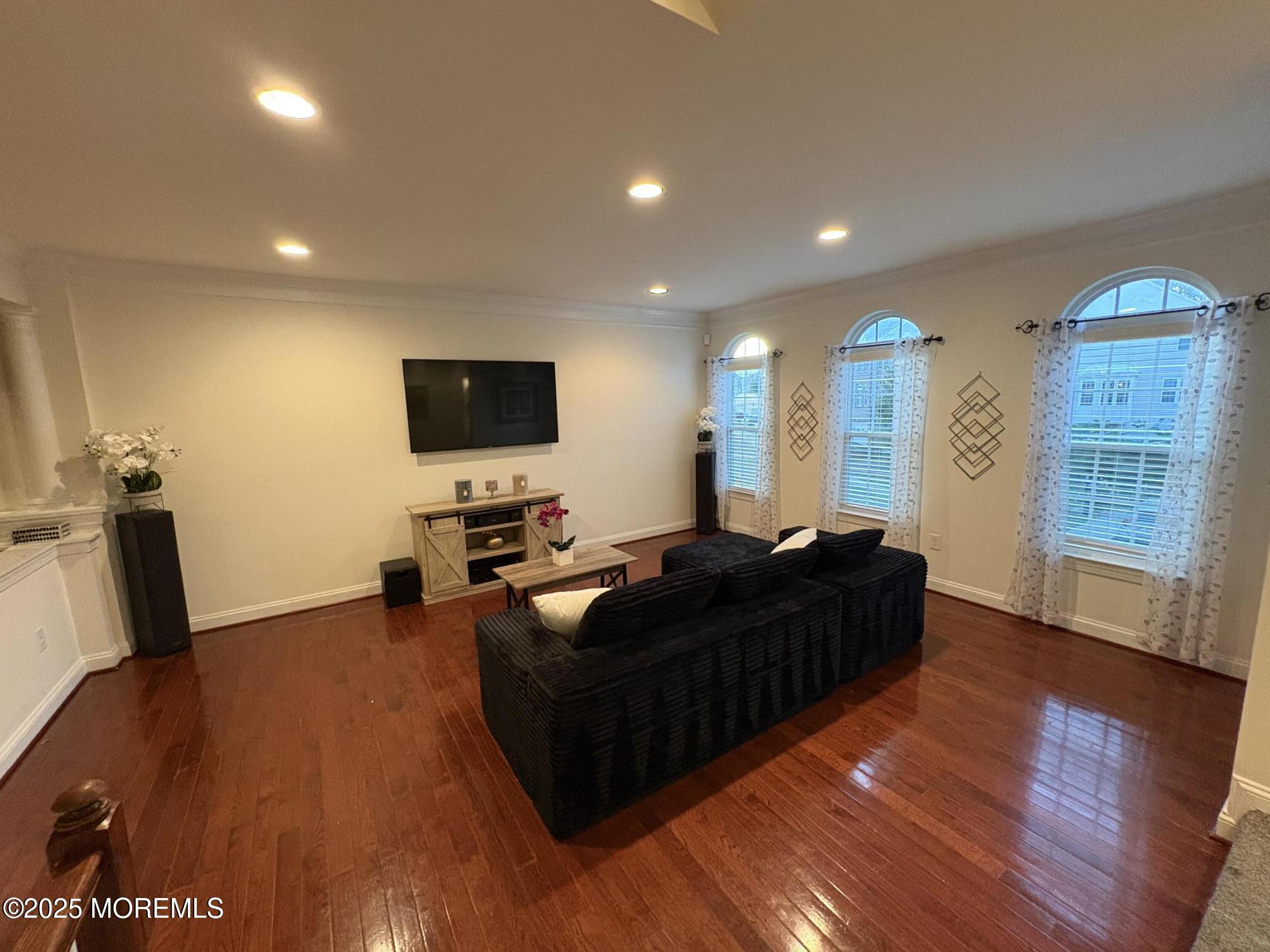 63 Pate Drive Middletown, NJ 07748 - Photo 6 of 50 a living room with furniture and a flat screen tv