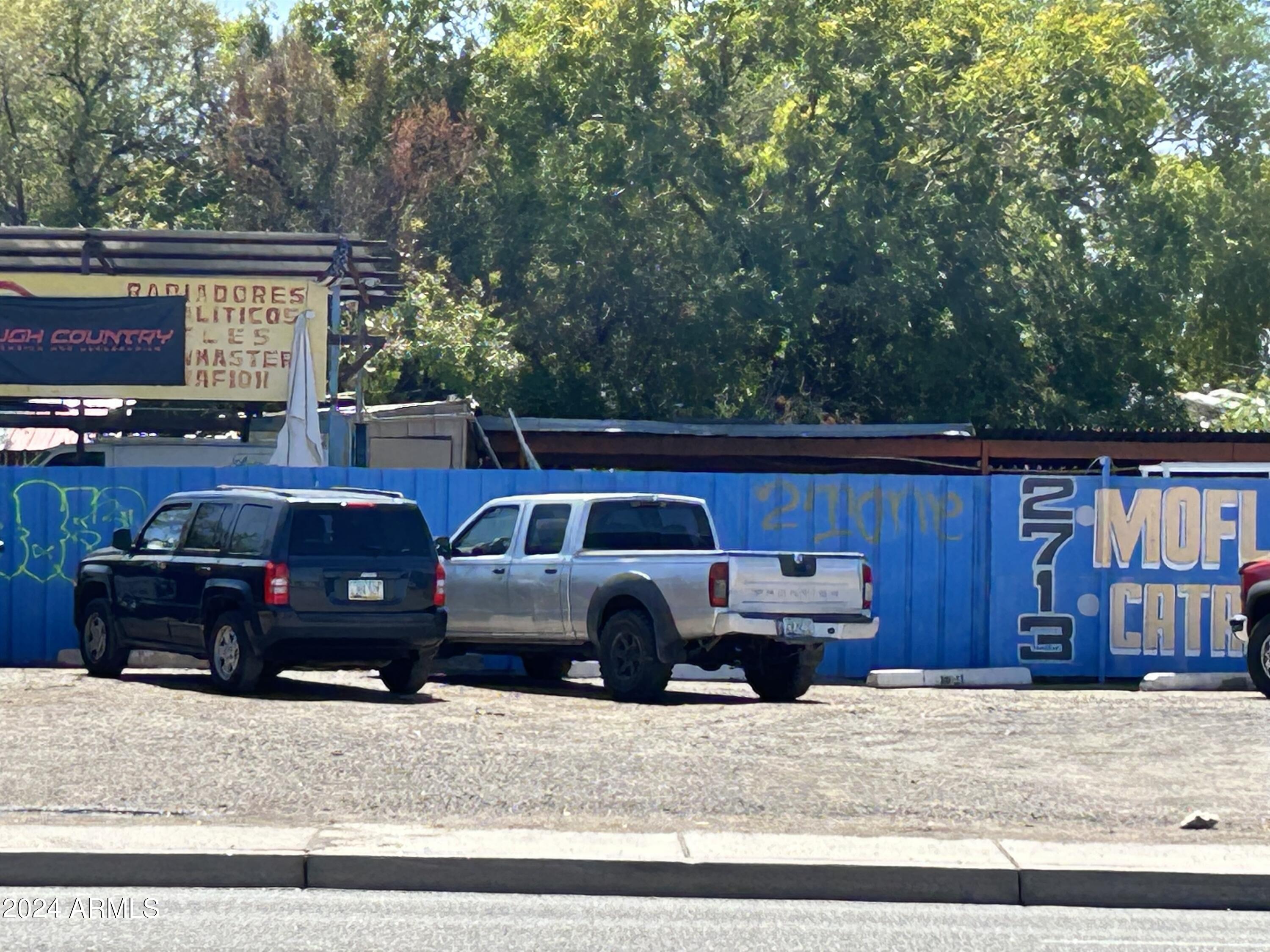 2725 East McDowell Road, Unit 13 Phoenix, AZ 85008 - Photo 4 of 5 a view of a car parked in front of a house