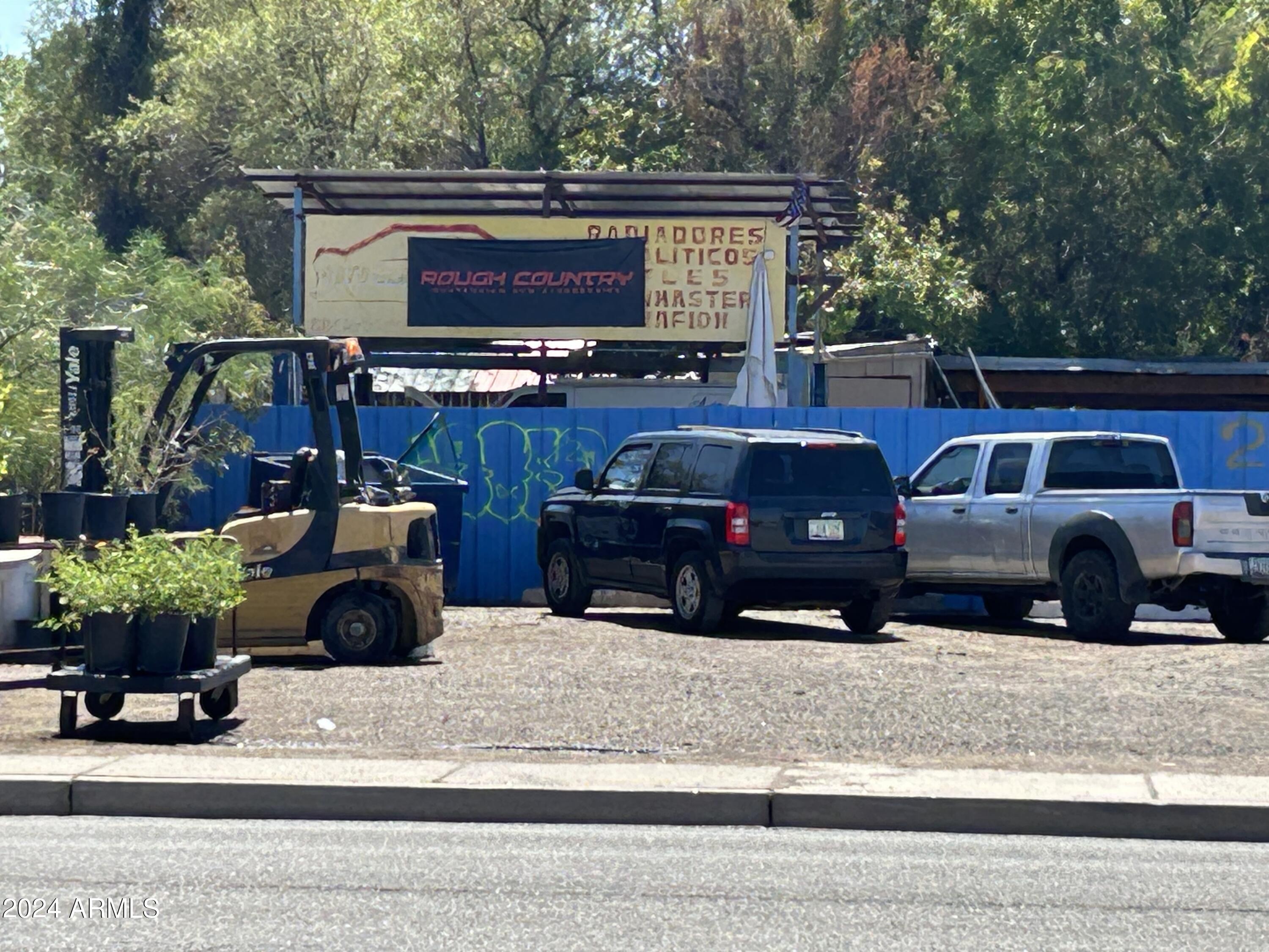 2725 East McDowell Road, Unit 13 Phoenix, AZ 85008 - Photo 5 of 5 a view of a cars park in front of a house