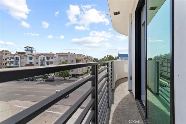 a view of an empty room with closet and entryway