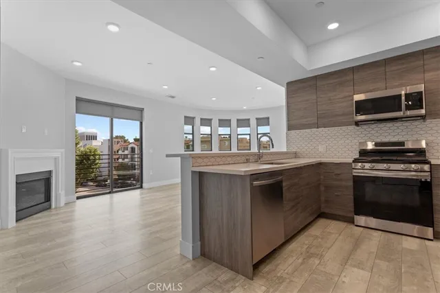 a kitchen with stainless steel appliances granite countertop a stove and a sink