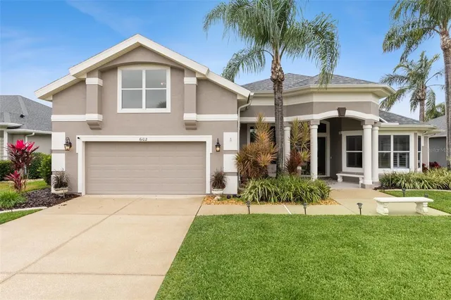 a front view of house with yard and outdoor seating