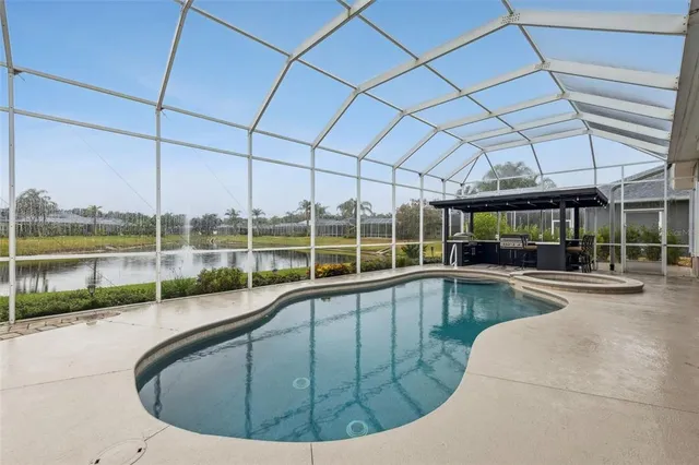 a view of a swimming pool with a patio