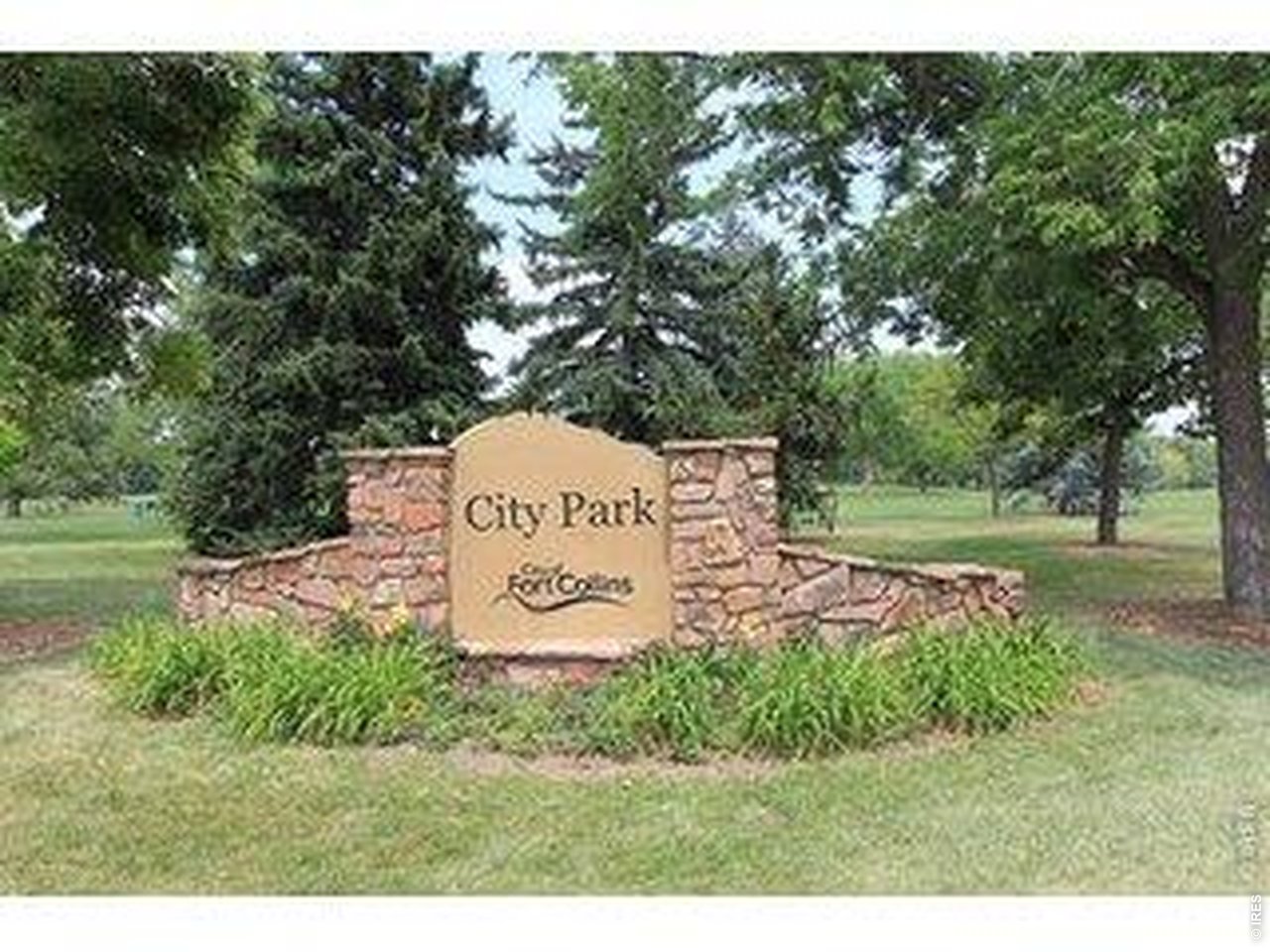 809 East Myrtle Street Fort Collins, CO 80524 - Photo 18 of 23 a sign board with a park bench