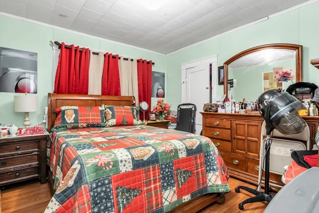 a bedroom with a bed and a dresser