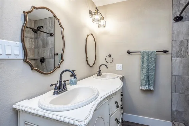 a bathroom with a sink and a mirror
