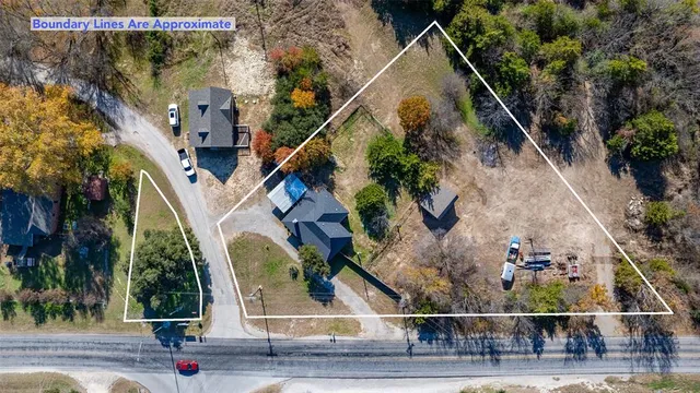 an aerial view of house with a yard