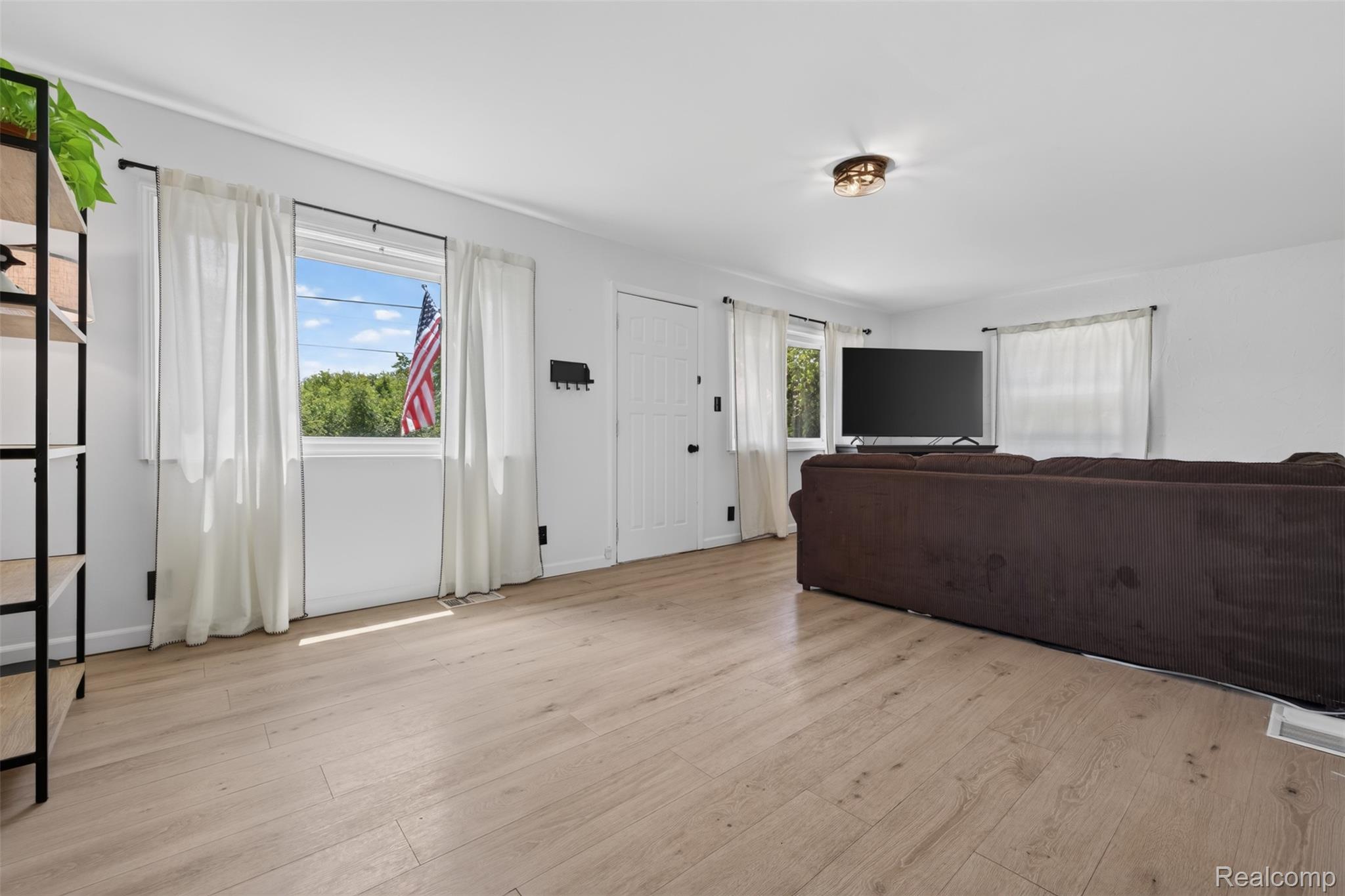 5244 Oleksyn Road Flint, MI 48504 - Photo 8 of 70 Bright interior featuring light wood-finish flooring and white walls