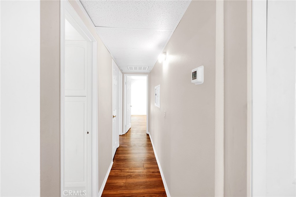 23677 Park Capri, Unit 20 Calabasas, CA 91302 - Photo 12 of 19 a view of a hallway with a white door