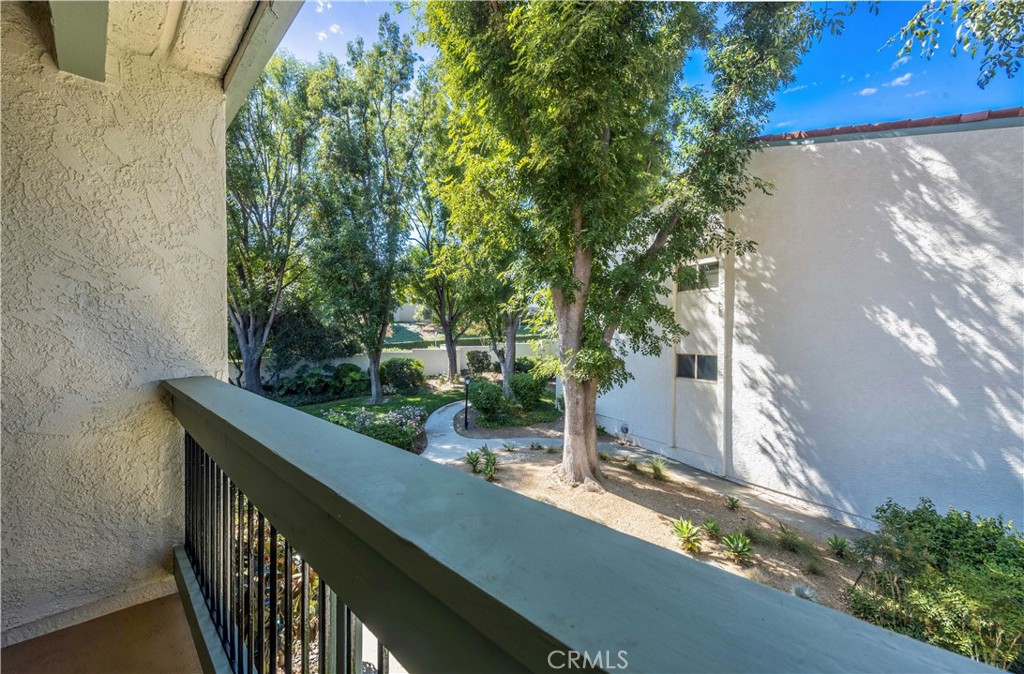 23677 Park Capri, Unit 20 Calabasas, CA 91302 - Photo 17 of 19 a view of a balcony and trees