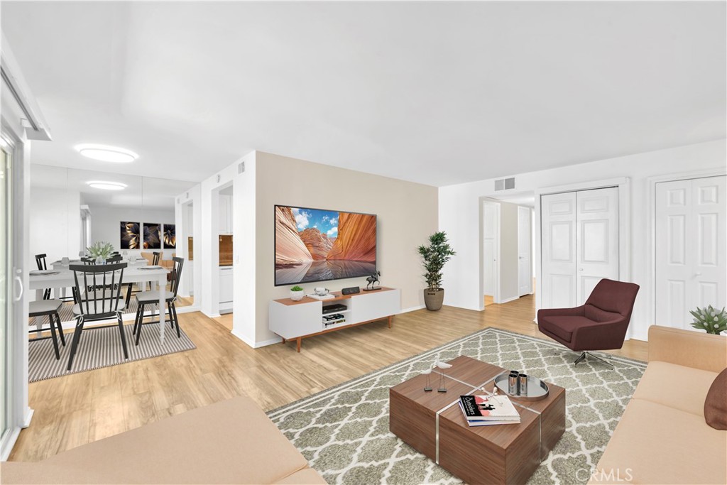 23677 Park Capri, Unit 20 Calabasas, CA 91302 - Photo 3 of 19 a living room with furniture and a flat screen tv