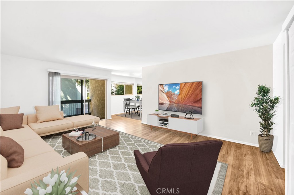 23677 Park Capri, Unit 20 Calabasas, CA 91302 - Photo 5 of 19 a living room with furniture and a flat screen tv