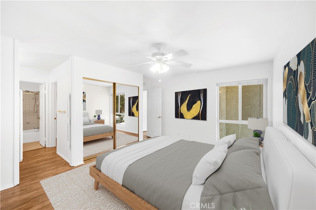 23677 Park Capri, Unit 20 Calabasas, CA 91302 - Photo 8 of 19 a bedroom with a bed and a couch