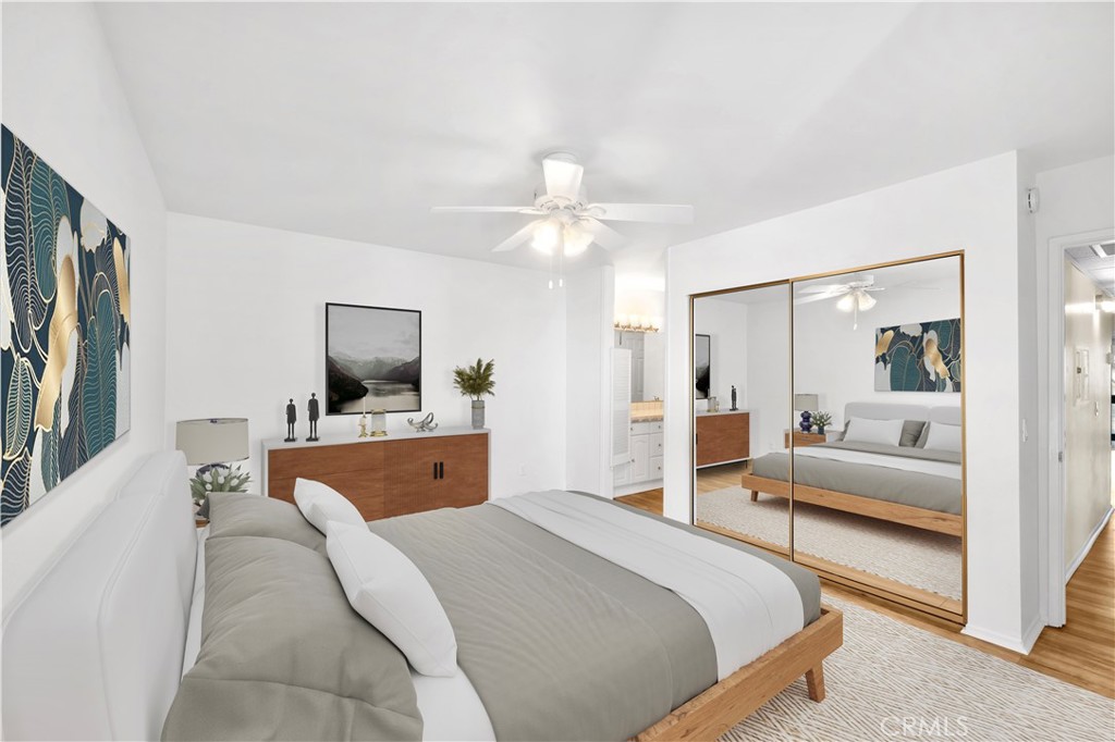 23677 Park Capri, Unit 20 Calabasas, CA 91302 - Photo 9 of 19 a bedroom with a large bed and a couch