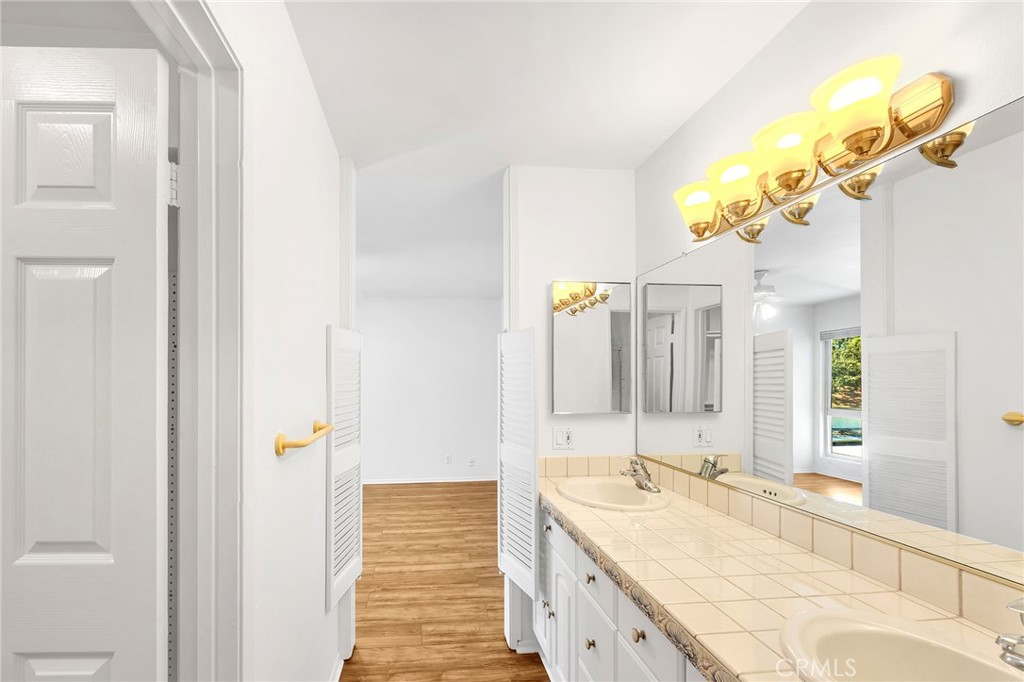 23677 Park Capri, Unit 20 Calabasas, CA 91302 - Photo 10 of 19 a spacious bathroom with a sink and a mirror