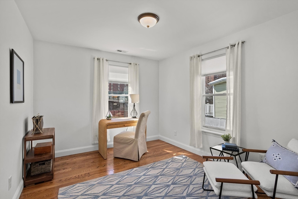 98 Flint Street, Unit 2 Somerville, MA 02145 - Photo 18 of 40 a living room with furniture and a window