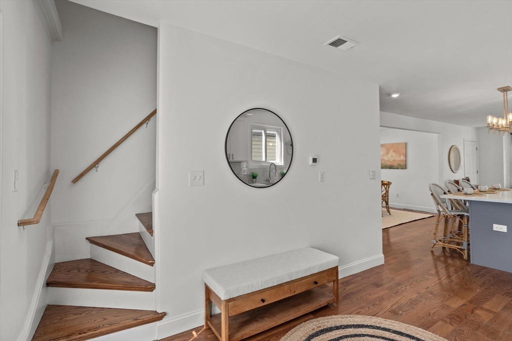 98 Flint Street, Unit 2 Somerville, MA 02145 - Photo 20 of 40 a living room with furniture and a mirror