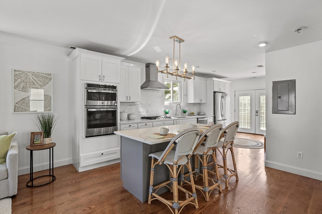 98 Flint Street, Unit 2 Somerville, MA 02145 - Photo 2 of 40 a view of a dining room with furniture and wooden floor