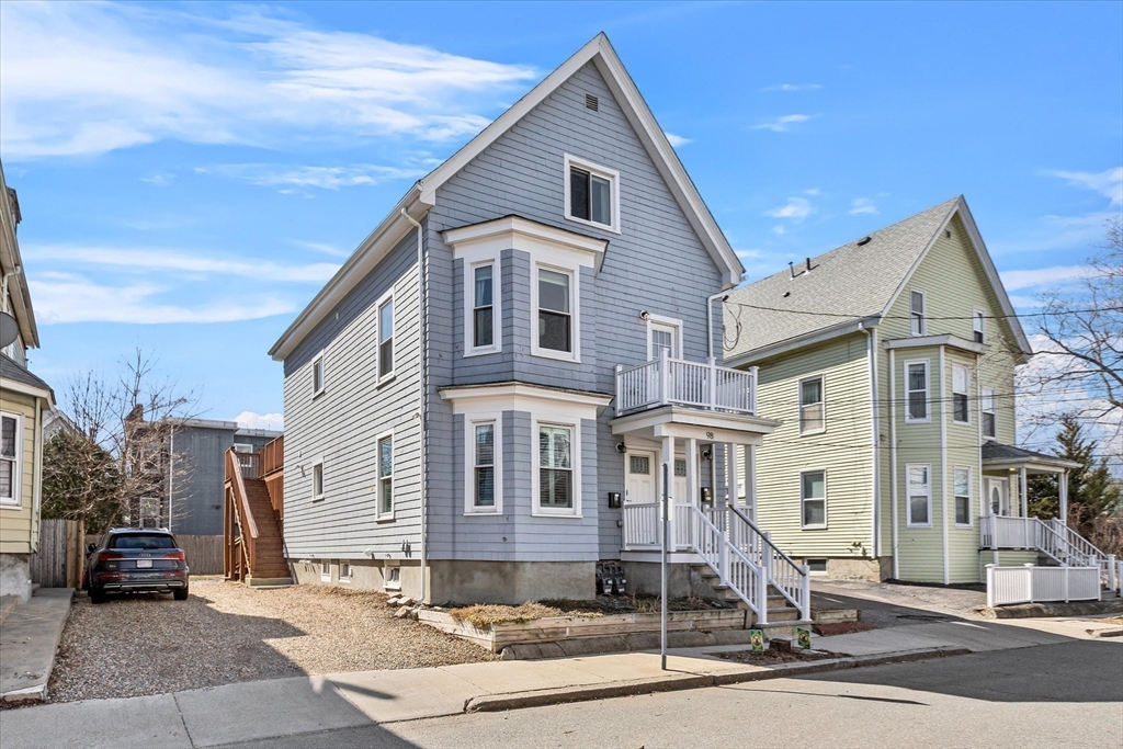 98 Flint Street, Unit 2 Somerville, MA 02145 - Photo 31 of 40 a front view of a house with a garage