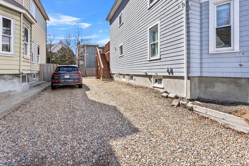 98 Flint Street, Unit 2 Somerville, MA 02145 - Photo 33 of 40 a car parked in front of a house