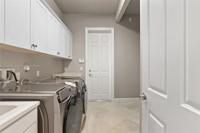 a bathroom with a granite countertop shower a sink and a mirror