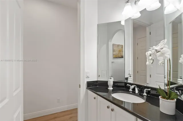 a view of workspace filled with furniture and wooden floor