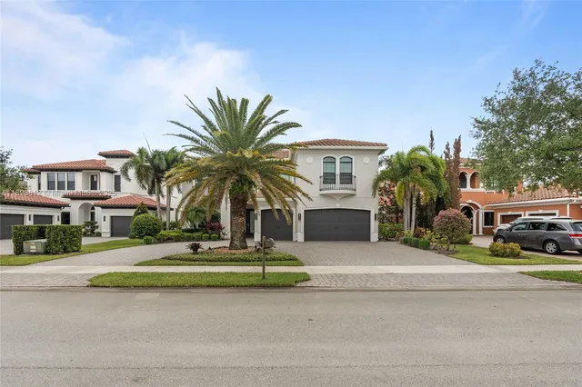 a front view of house with yard and green space