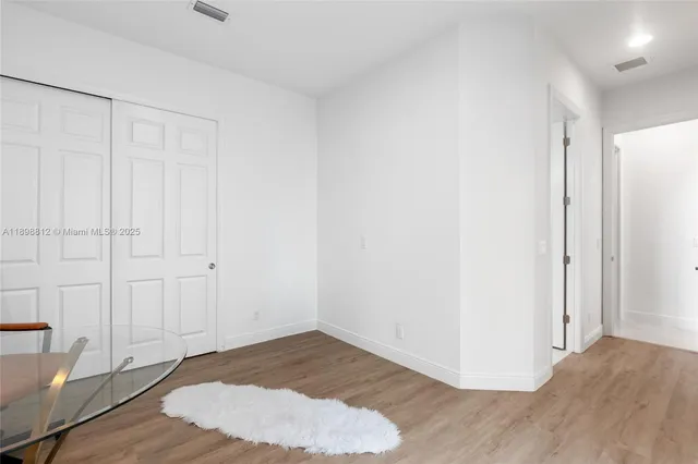 a bedroom with bed and a couch