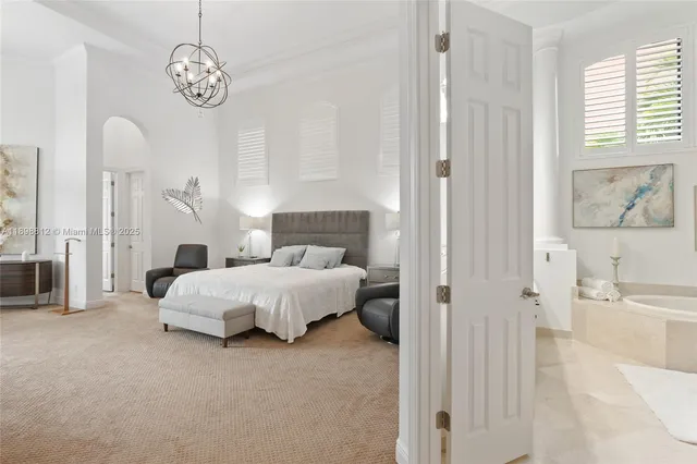 a living room with furniture large window and a flat screen tv