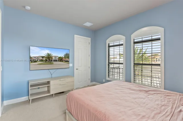 a view of a room with a black and white checkered floor