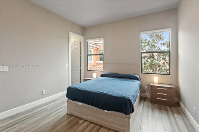 a view of a patio with couches and a fire pit