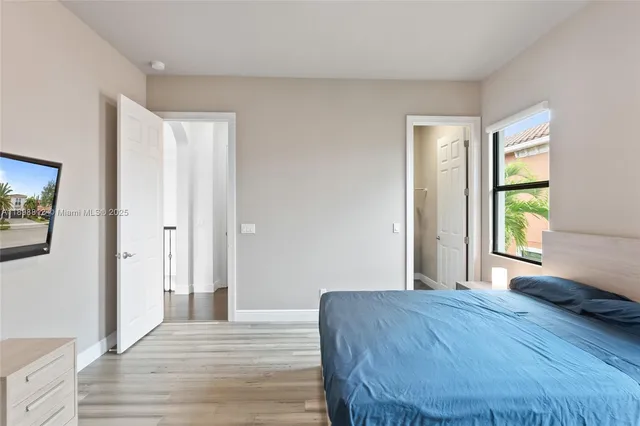 a kitchen with a stove a sink and a microwave