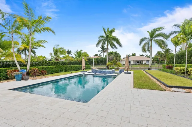 an aerial view of multiple houses with yard