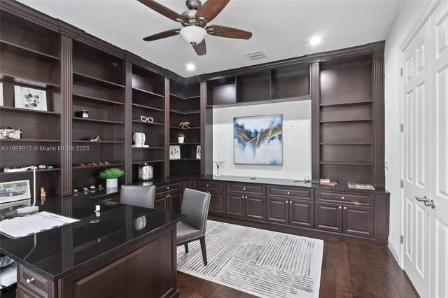a living room with furniture a fireplace and a chandelier