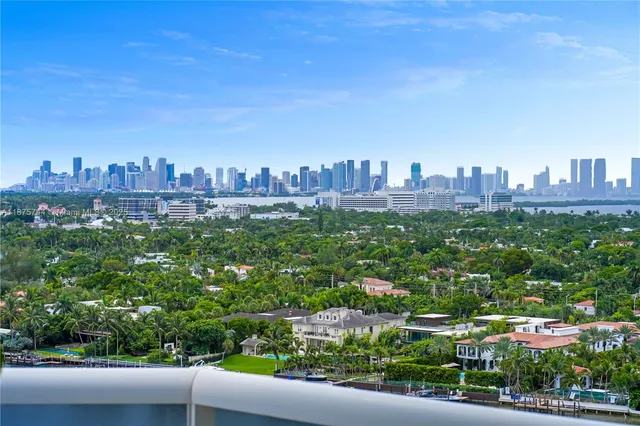 a kitchen with stainless steel appliances granite countertop a sink refrigerator and cabinets