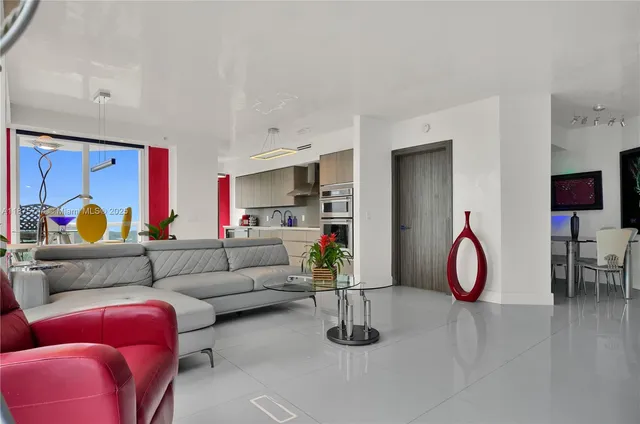 a living room with furniture gym equipment and a projector