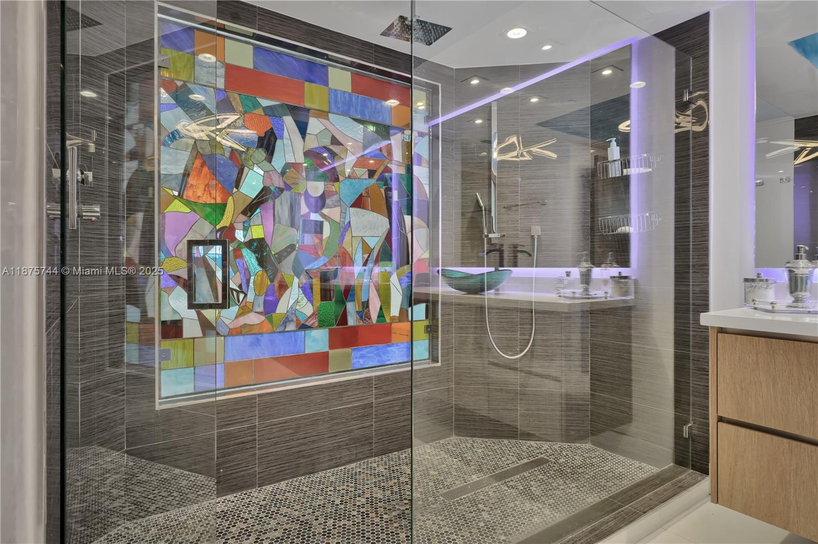 4779 Collins Avenue, Unit 1805 Miami Beach, FL 33140 - Photo 29 of 39 a bathroom with a shower