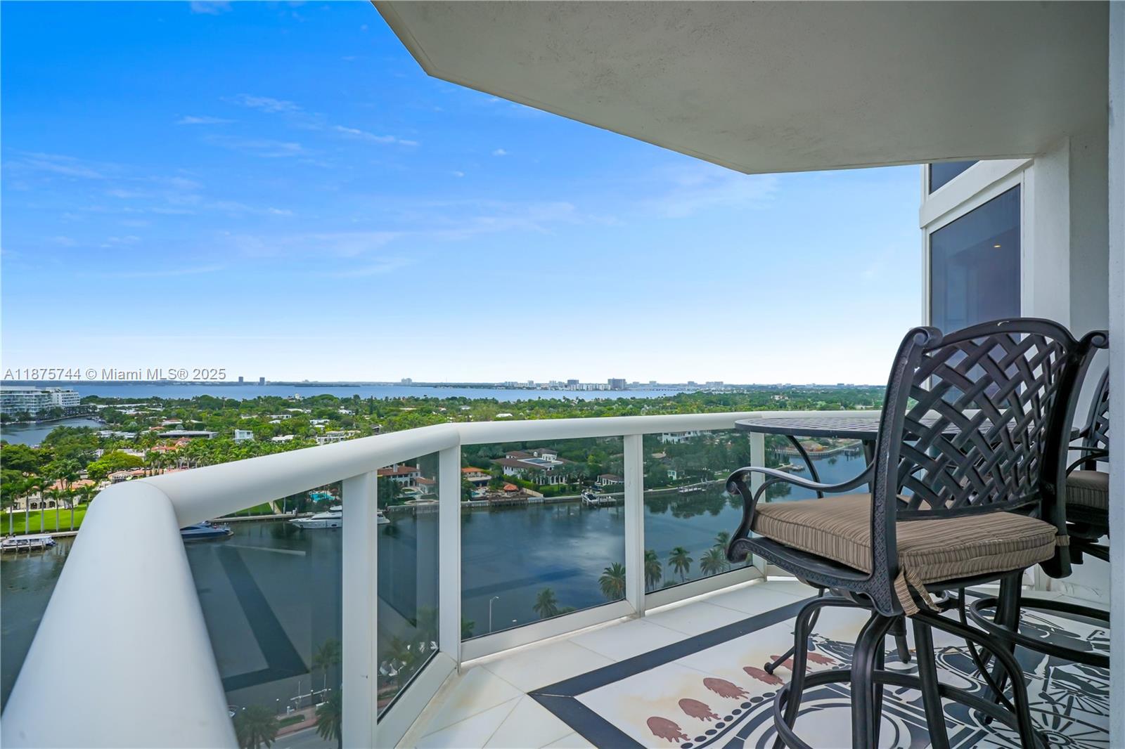 4779 Collins Avenue, Unit 1805 Miami Beach, FL 33140 - Photo 38 of 39 a view of a chairs and table in the balcony