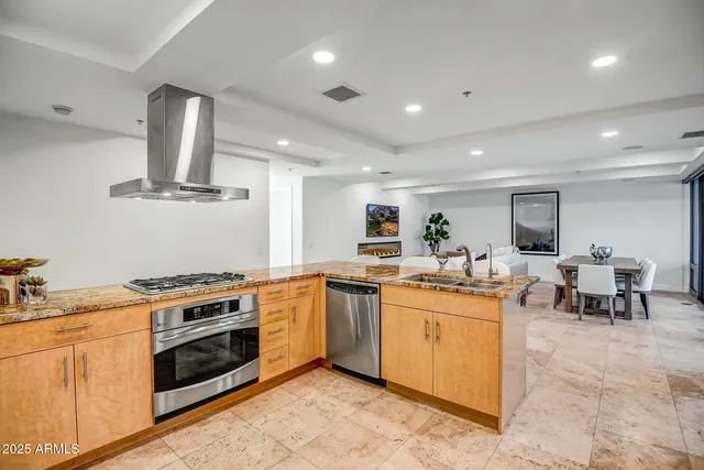 a living room with furniture window and wooden floor