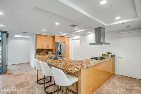 a kitchen with a stove and a sink