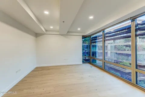 wooden view of an empty room with a balcony