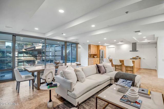 a dining room with furniture and window