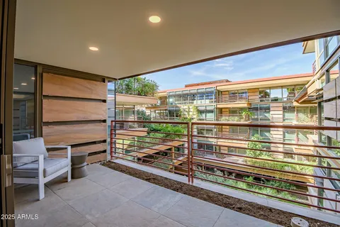 a view of balcony with furniture