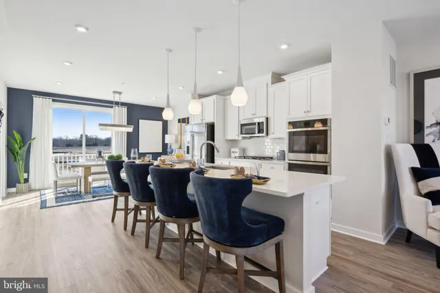 a view of kitchen with dining table and chairs