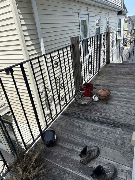 5 Lowden Avenue, Unit 2 Somerville, MA 02144 - Photo 20 of 20 a view of a porch with wooden floor