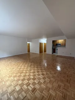 a view of a livingroom with furniture nad wooden floor